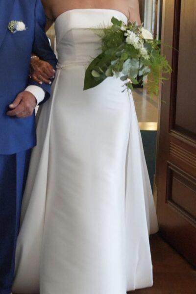 Strapless jurk met strik en of overrok