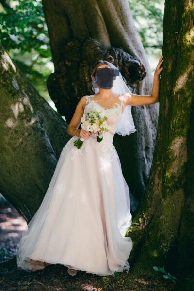 Elegante trouwjurk met kanten top, blush ondertoon én bijpassende onderjurk