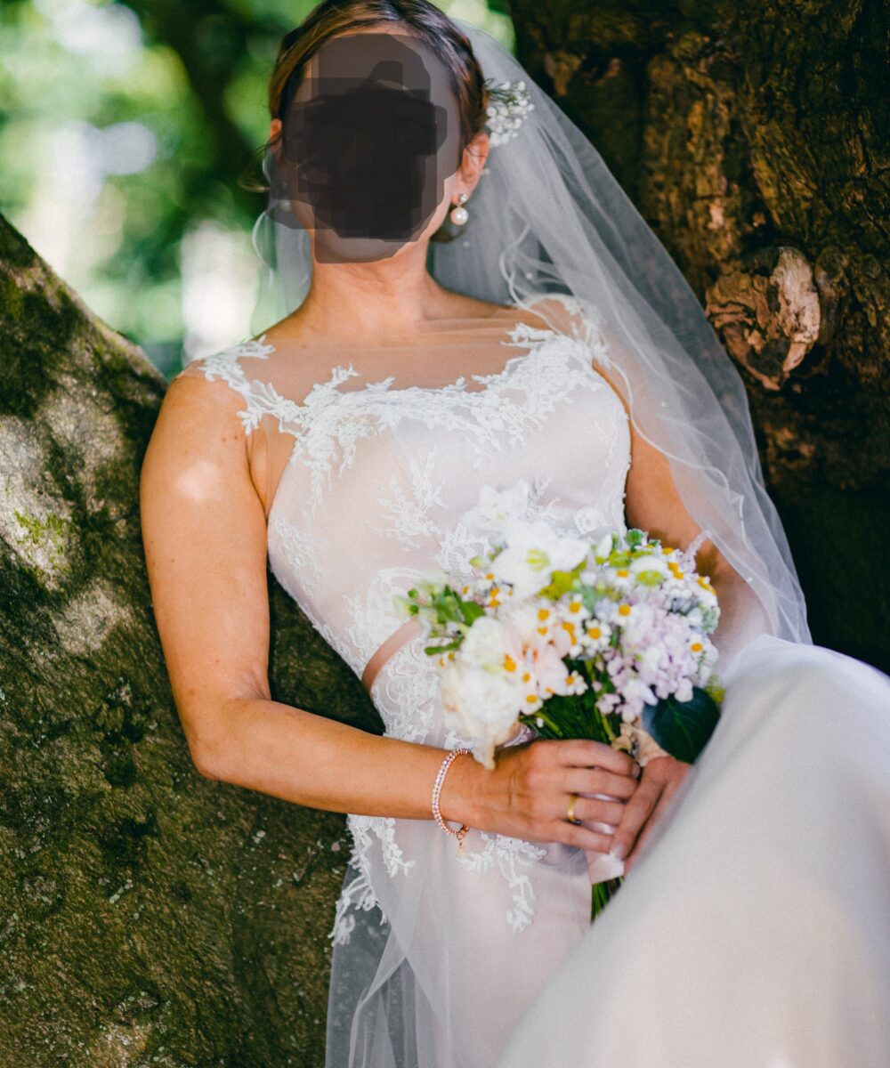 Elegante trouwjurk met kanten top, blush ondertoon én bijpassende onderjurk