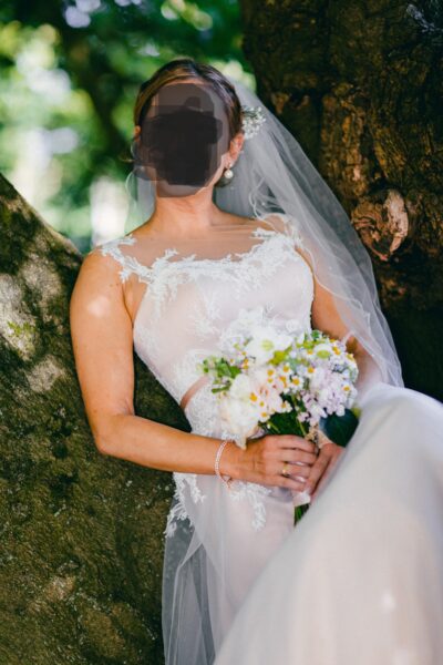 Elegante trouwjurk met kanten top, blush ondertoon én bijpassende onderjurk